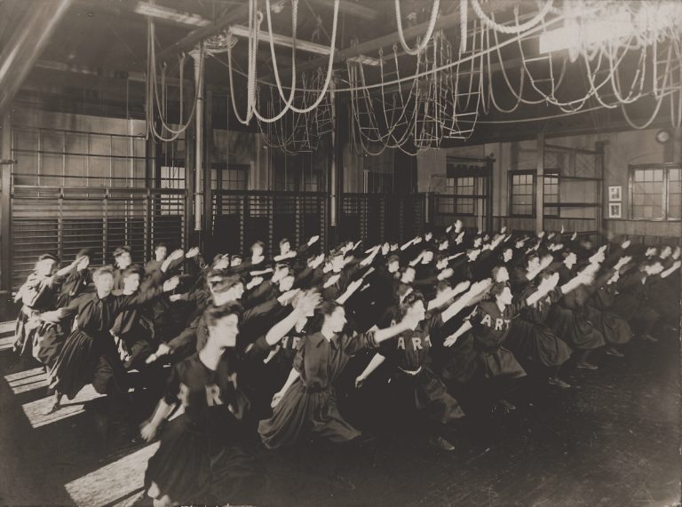 Sepia image of women lunging