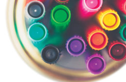 Colored markers in glass jar