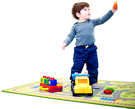 Young boy playing with toys