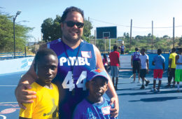ben kay with kids on a basketball court
