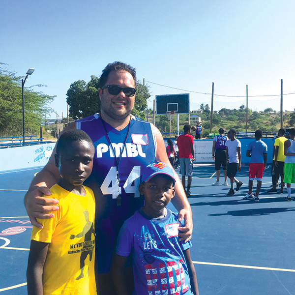 ben kay with kids on a basketball court