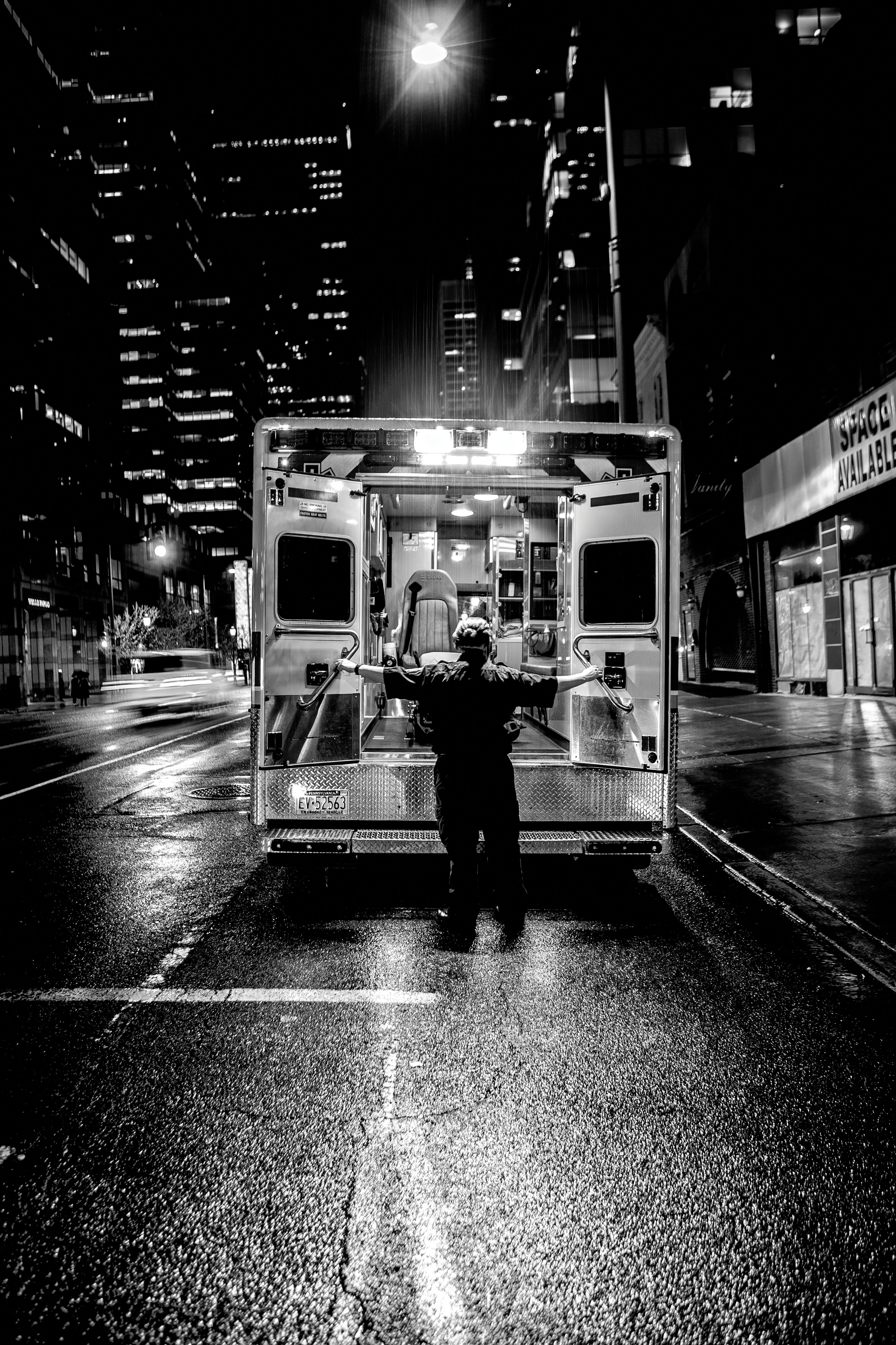 Paramedic opening ambulance doors