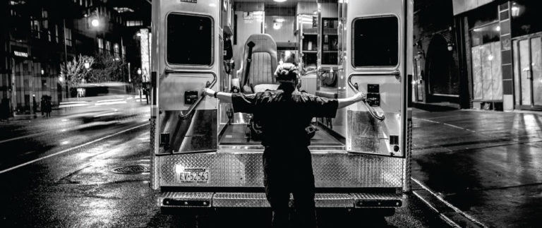 a medic opening an ambulance door