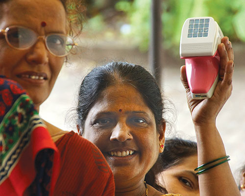 a woman holding the breast cancer device