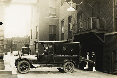 two nurses by an ambulance