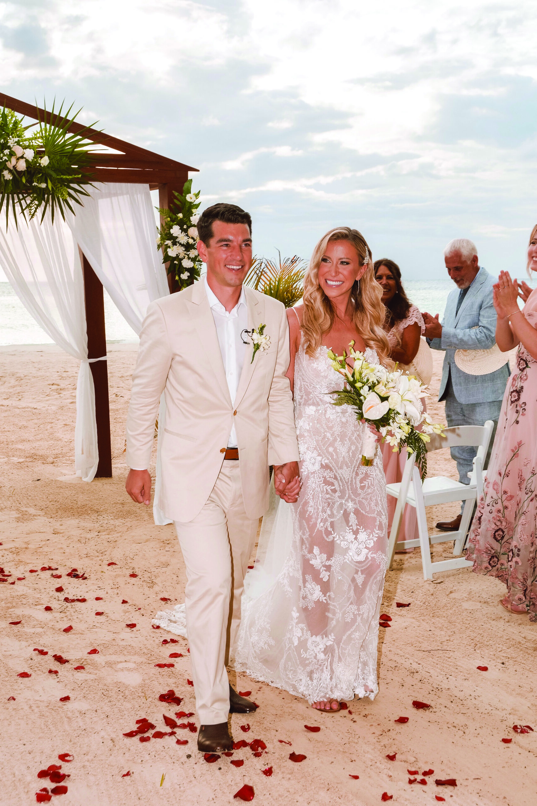 Emily Maiers and Zachary Gosling walk down the aisle at their wedding