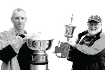 Drexel rowing coaches holding trophies