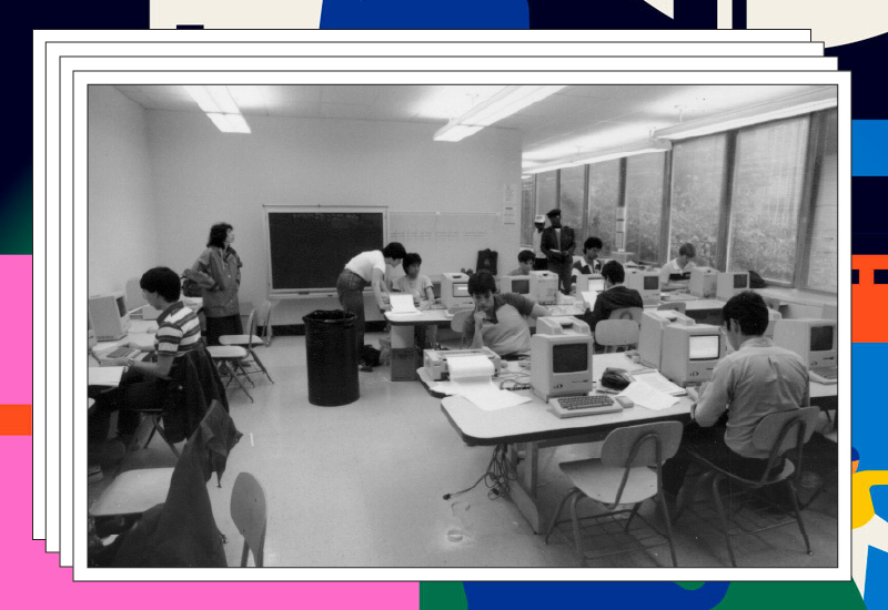 A black and white photo of a Drexel classroom full of students working at early Macintosh computers