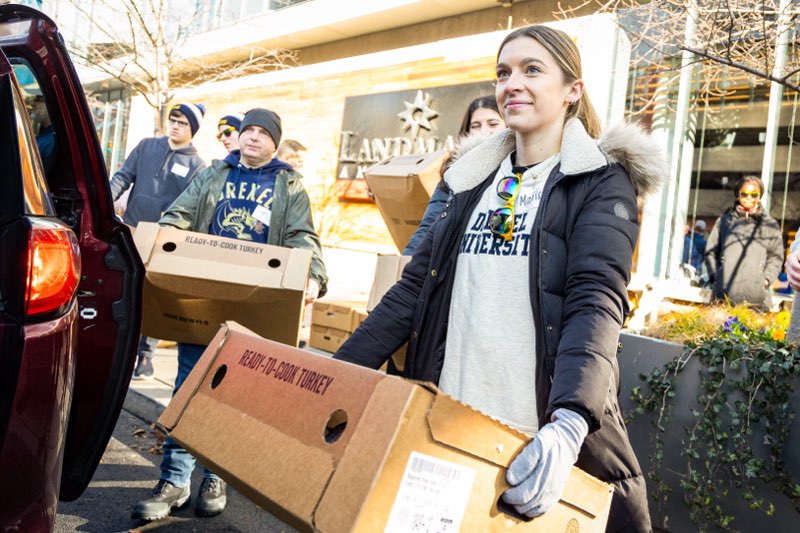 A Turkey Project volunteer loads food onto a truck