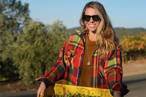 Alison Carroll holding a crate of olives