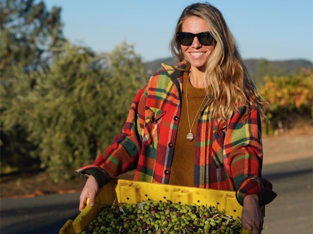 Alison Carroll holding a crate of olives